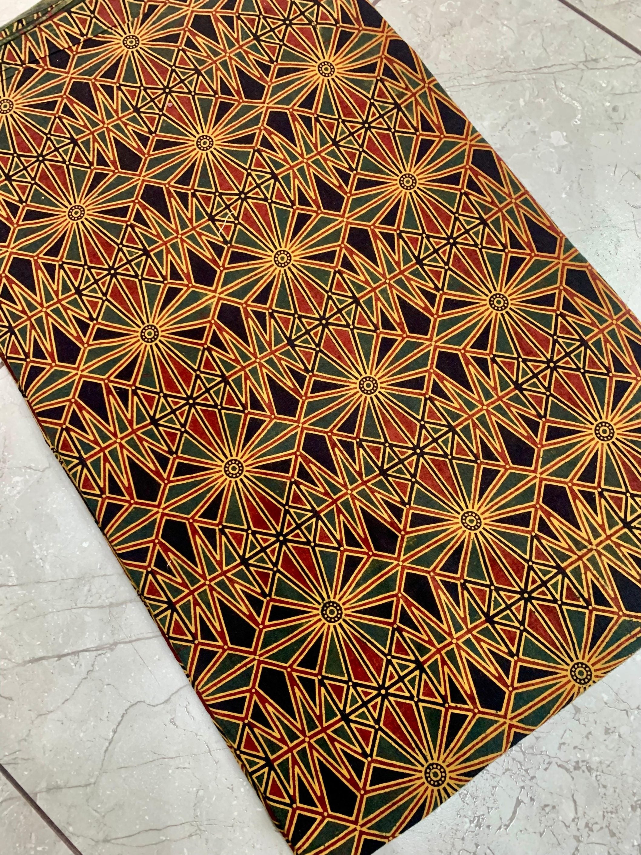 Green and red Ajrakh handblock printed cotton wholesale fabric with dual-tone traditional motifs from Kutch artisans
